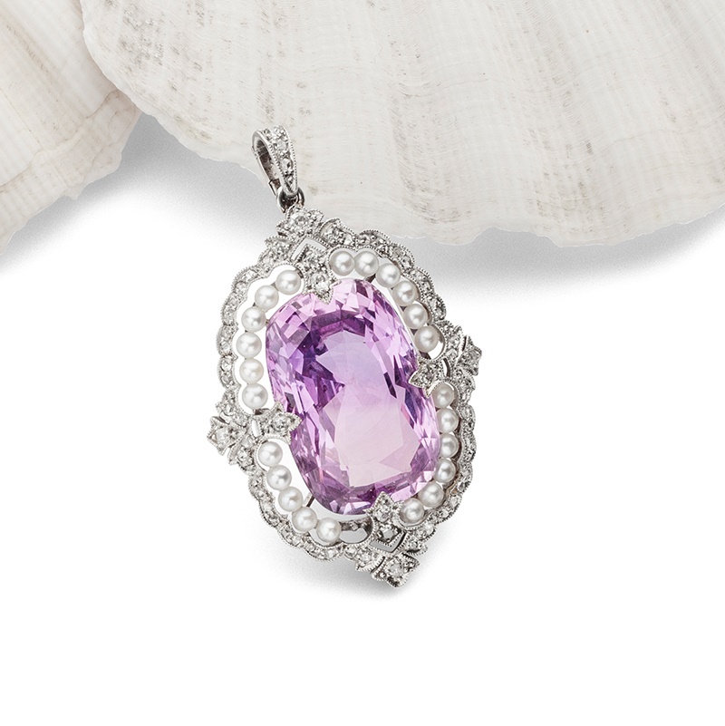 An American Art Deco pink sapphire, seed pearl and diamond pendant, 1920s | Sold for £195,000*